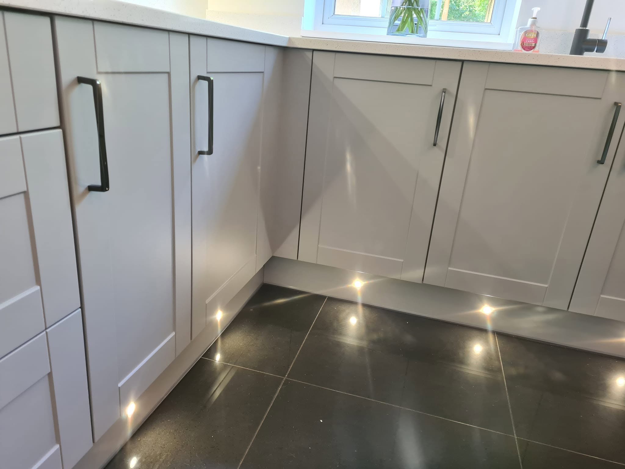 Kitchen units with plinth lighting