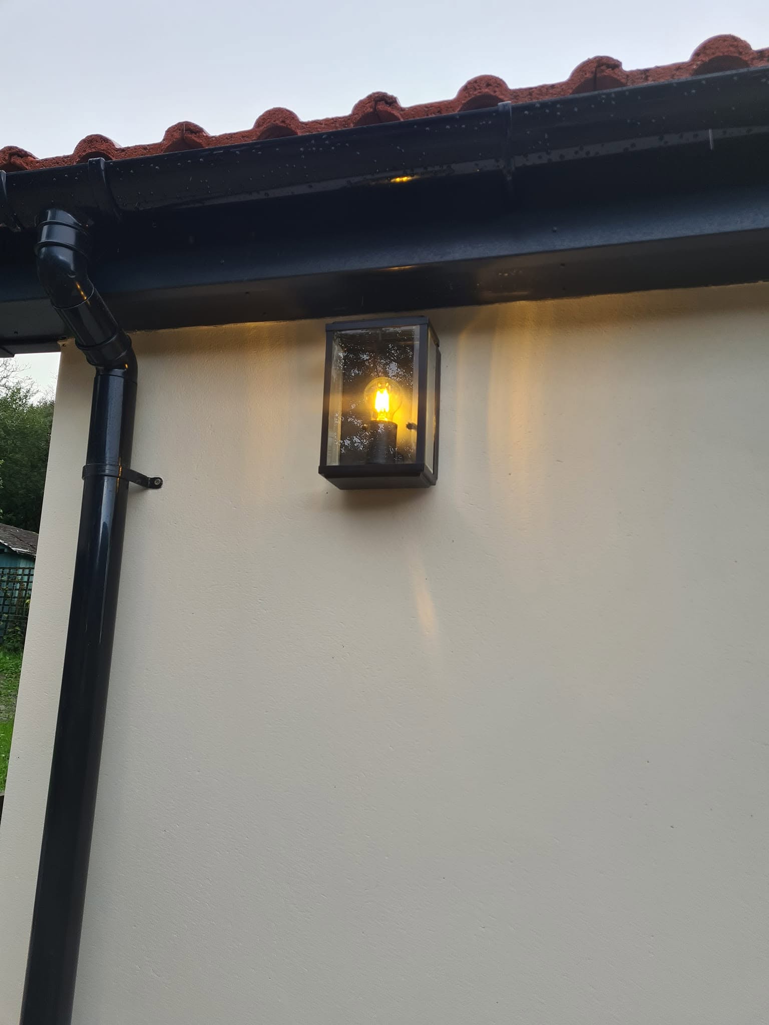 Exterior wall lantern at dusk