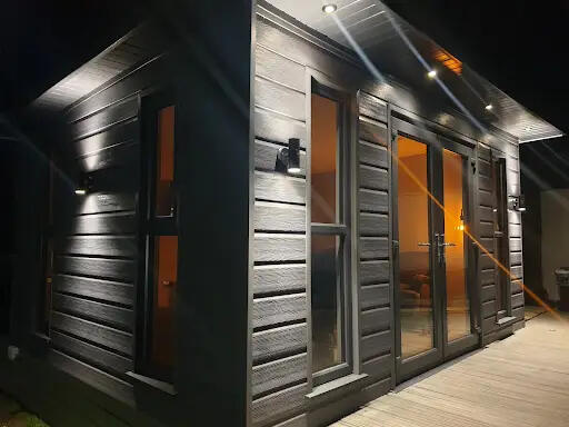 Garden room with exterior lighting at night